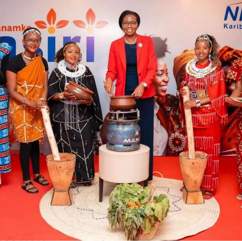NMB executive and Maasai women at a cultural display for International Women's Day