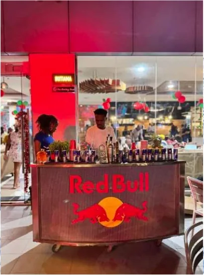 Red Bull branded bar cart and premium service inside an upscale Dar es Salaam outlet