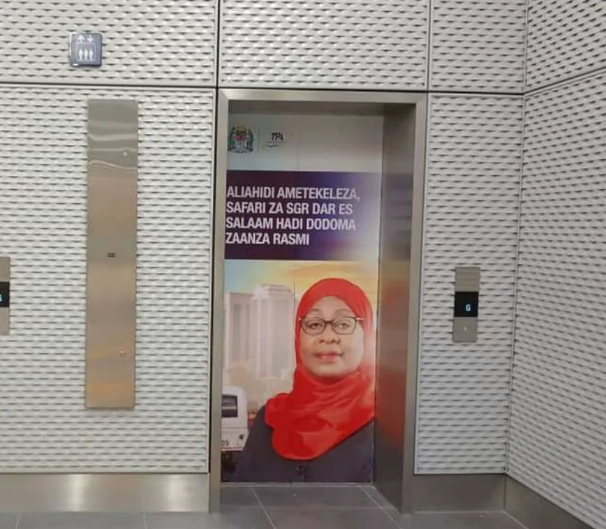 SGR station elevator door branded with government railway messaging