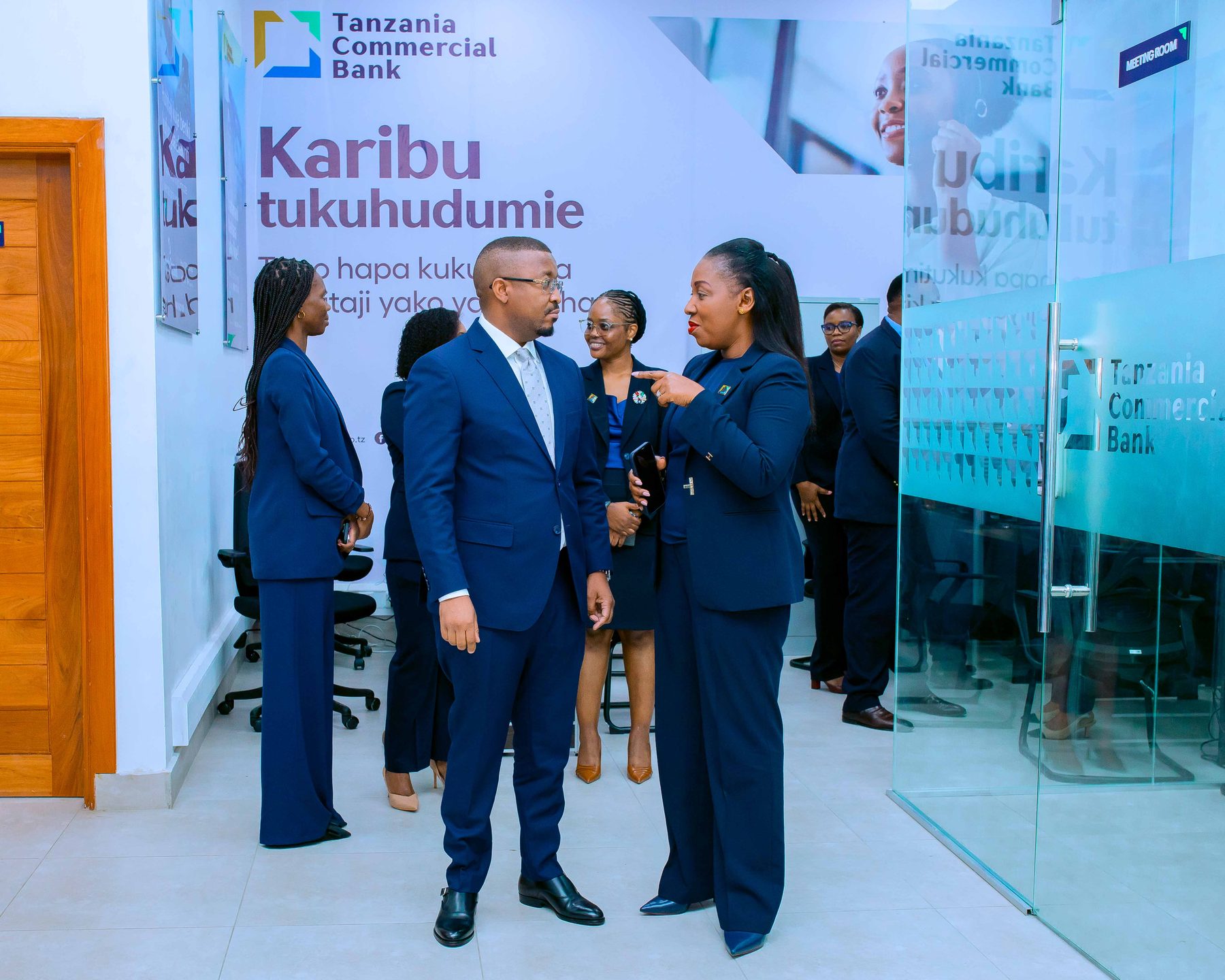 TCB staff welcoming guests inside the new Kariakoo branch