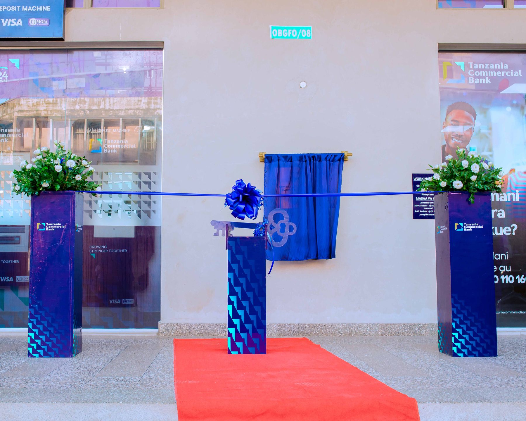 Ribbon-cutting setup at the entrance of TCB's new Kariakoo branch