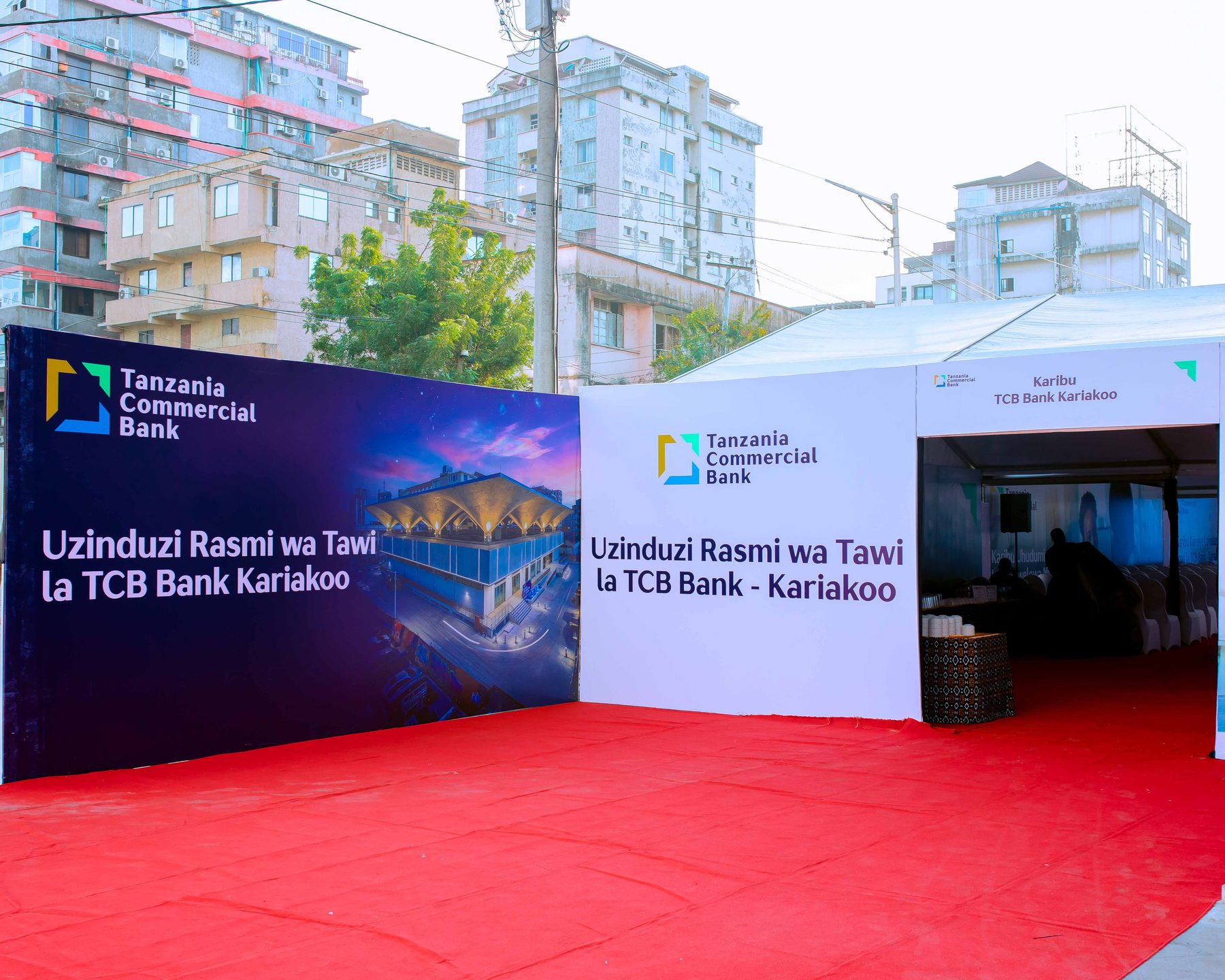 Branded backdrop and tent entrance, TCB Kariakoo branch launch