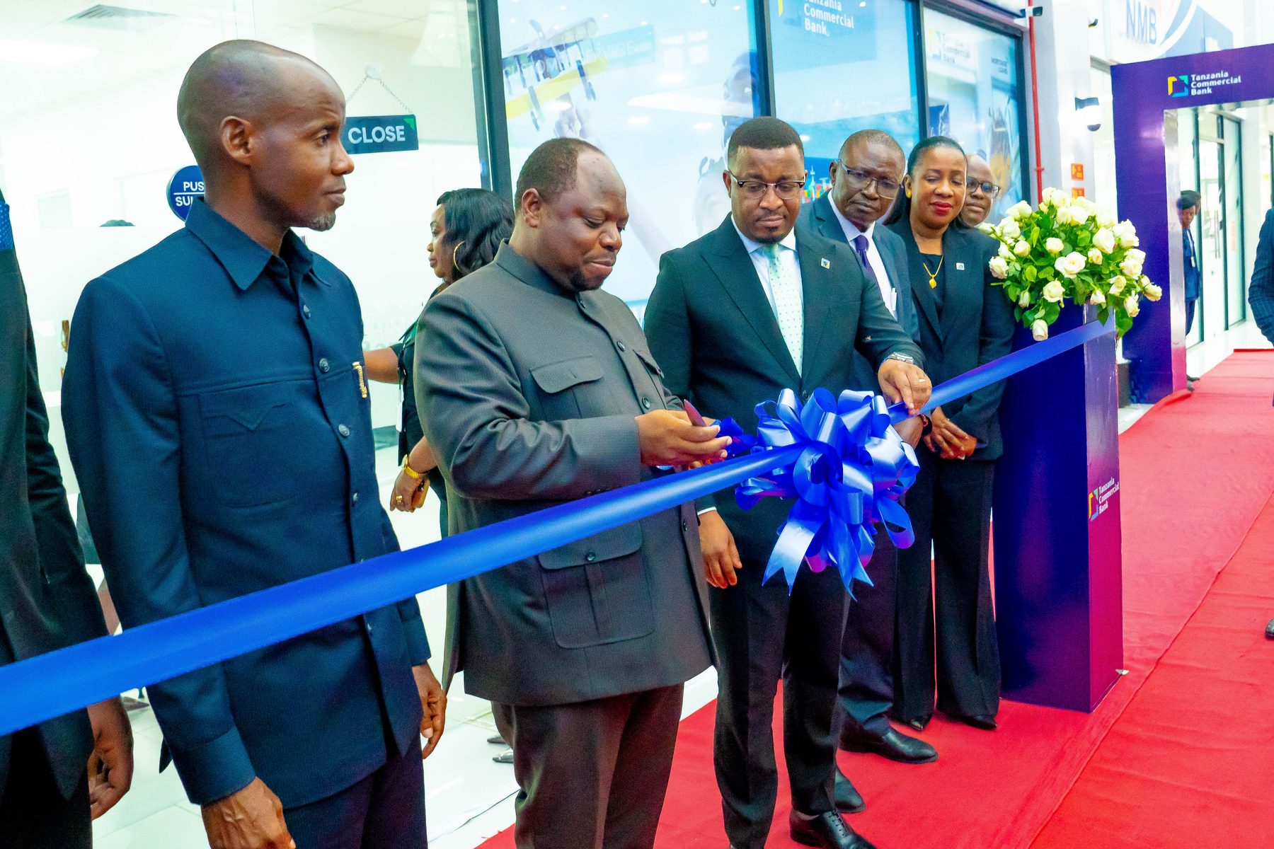 Ribbon-cutting ceremony with TCB dignitaries at the Ubungo branch launch