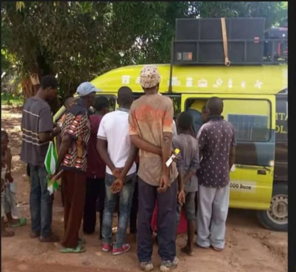 Mobisol branded mobile promotion van touring rural communities in Tanzania